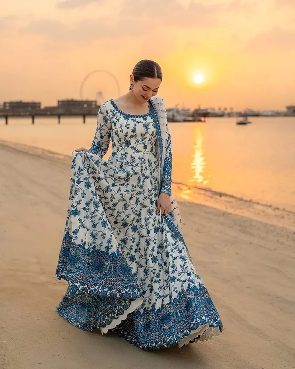 WHITE_FAUX_GEORGETTE_ANARKALI_SUIT_WITH_SEQUENCE_WORK