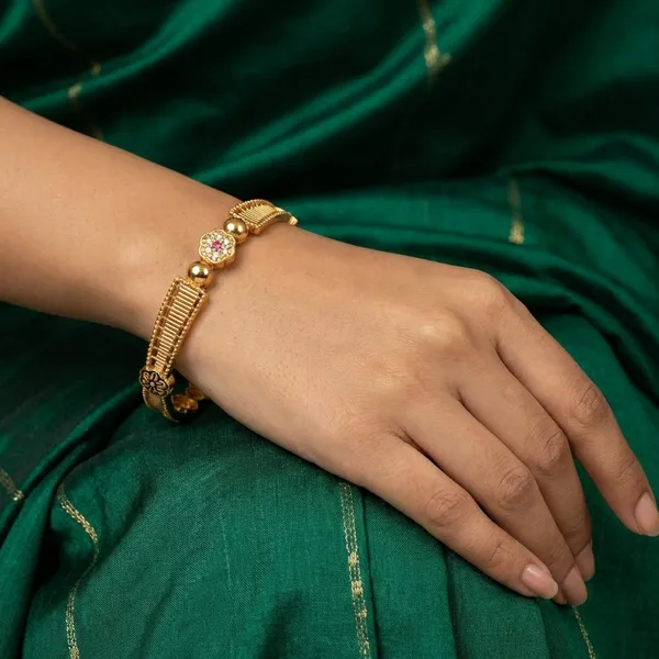 Gold_Metal_With_Stone_Embellishments_Bangles_For_Women