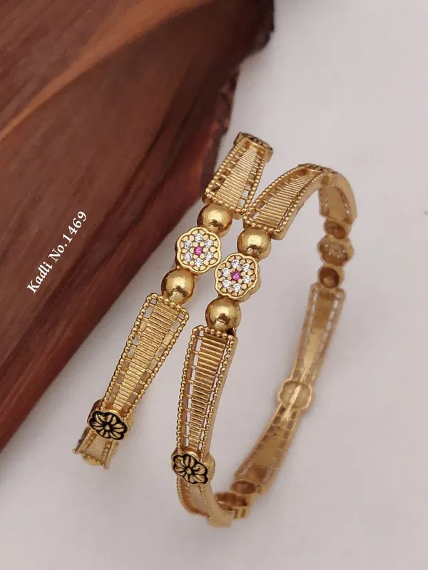 Gold_Metal_With_Stone_Embellishments_Bangles_For_Women