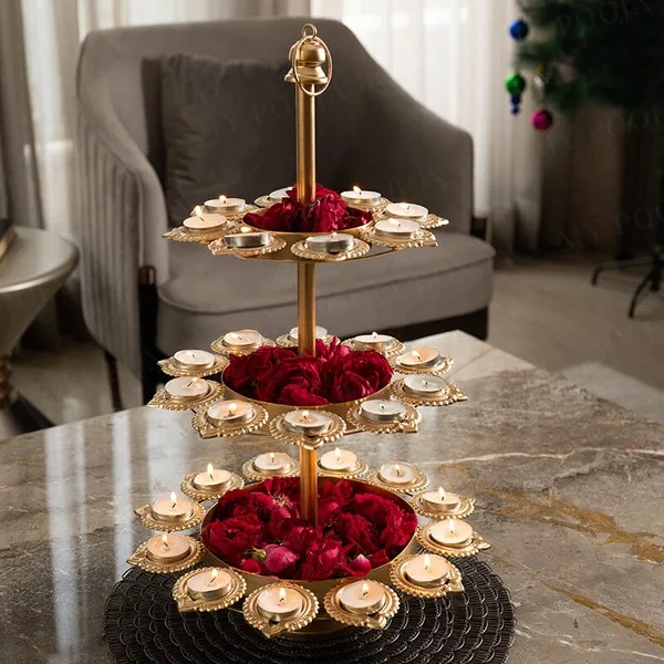 Gold_Tierplated_Diya_Stand_With_Candles_And_Flower_Decoration