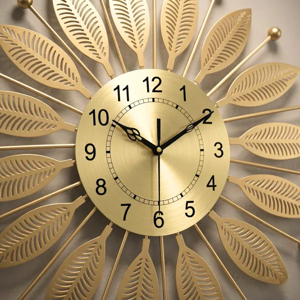 Luxury_Gold_Metal_Leaf_Wall_Clock_–_Elegant_Sunburst_Designer_Wall_Clock_for_Living_Room_&_Office_Décor