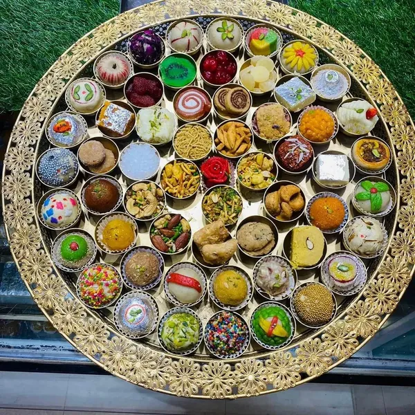 Assorted_Miniature_Desserts_And_Sweets_Collection_In_Decorative_Tray