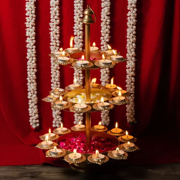 Gold_Tierplated_Diya_Stand_With_Candles_And_Flower_Decoration