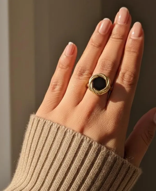 Elegant_Gold_Toned_Ring_With_Black_Stone_And_Textured_Band_For_Women