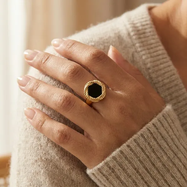 Elegant_Gold_Toned_Ring_With_Black_Stone_And_Textured_Band_For_Women