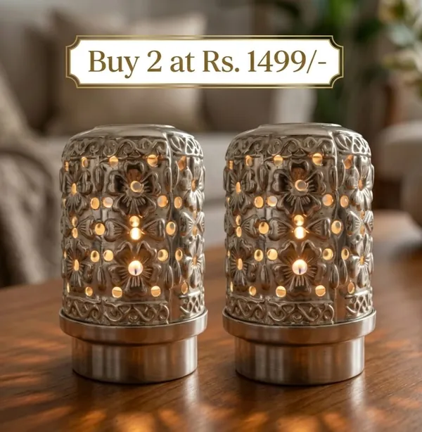 Decorative_Metal_Candle_Holder_With_Floral_Cutout_Design
