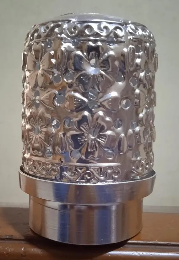 Decorative_Metal_Candle_Holder_With_Floral_Cutout_Design