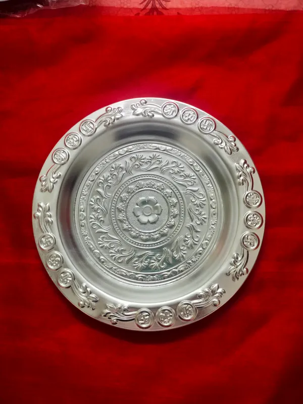 Decorative_Silver_Toned_Metal_Plate_With_Traditional_Floral_And_Circular_Motifs