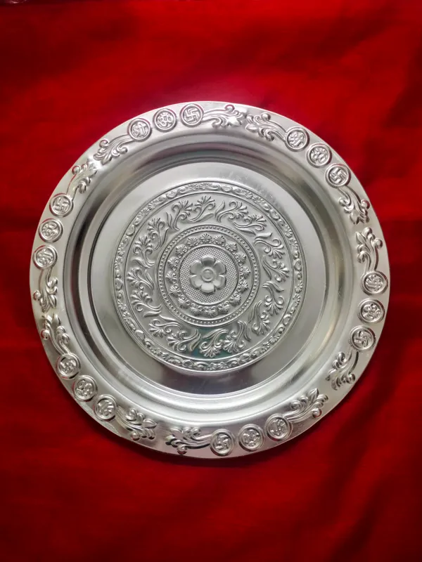 Decorative_Silver_Toned_Metal_Plate_With_Traditional_Floral_And_Circular_Motifs