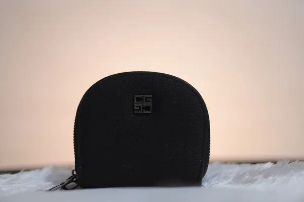 Black_Rounded_Zip_Pouch_With_Logo._Buy_1_Get_1_Free_Colour_May_Be_Varey