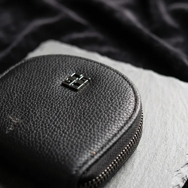 Black_Rounded_Zip_Pouch_With_Logo._Buy_1_Get_1_Free_Colour_May_Be_Varey