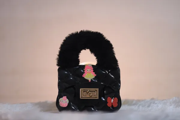 Black_Quilted_Handbag_With_Floral_Embellishments_And_Faux_Fur_Handle._Buy_1_Get_1_Free_Colour_May_Be_Varey