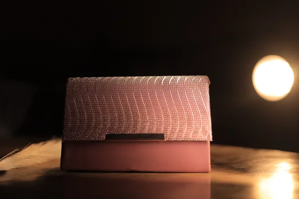 Elegant_Pink_Textured_Clutch_With_Woven_Flap_Design._Buy_1_Get_1_Free_Colour_May_Be_Varey