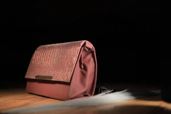 Elegant_Pink_Textured_Clutch_With_Woven_Flap_Design._Buy_1_Get_1_Free_Colour_May_Be_Varey