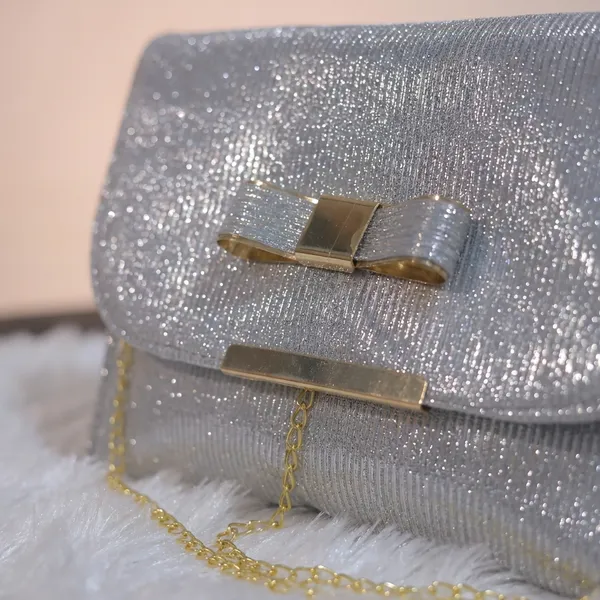 Elegant_Silver_Shimmer_Evening_Clutch_With_Bow_Detail._Buy_1_Get_1_Free_Colour_May_Be_Varey