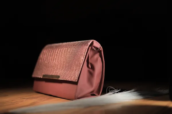 Elegant_Pink_Textured_Clutch_With_Woven_Flap_Design._Buy_1_Get_1_Free_Colour_May_Be_Varey