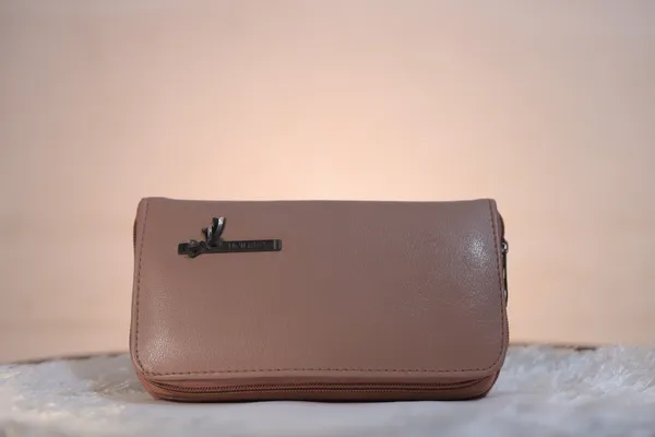 Premium_Leather_Wallet_With_Metal_Accent._Buy_1_Get_1_Free_Colour_May_Be_Varey