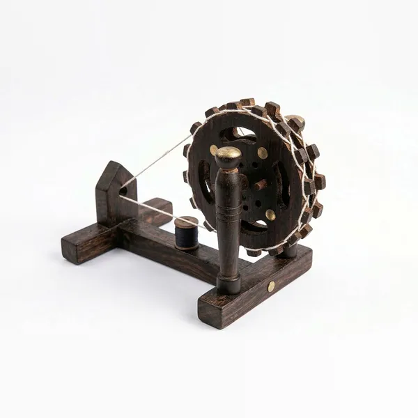 Handcrafted_Miniature_Wooden_Charkha_–_Traditional_Indian_Spinning_Wheel_Model