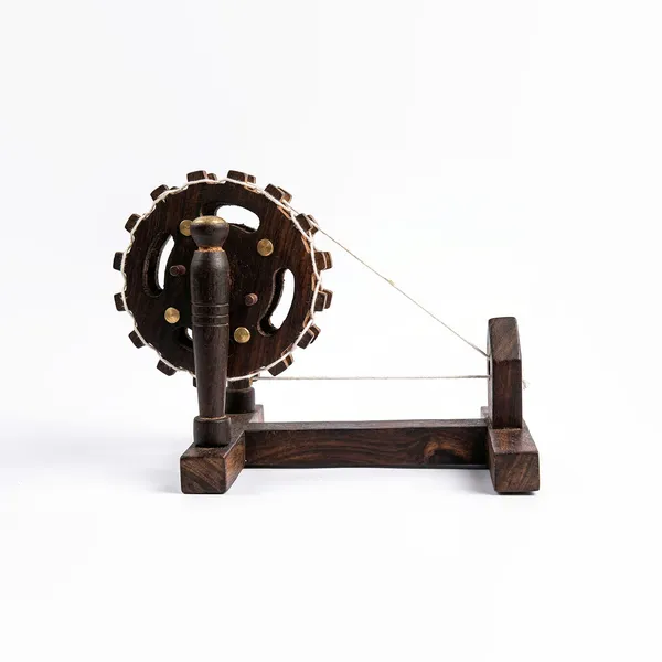 Handcrafted_Miniature_Wooden_Charkha_–_Traditional_Indian_Spinning_Wheel_Model