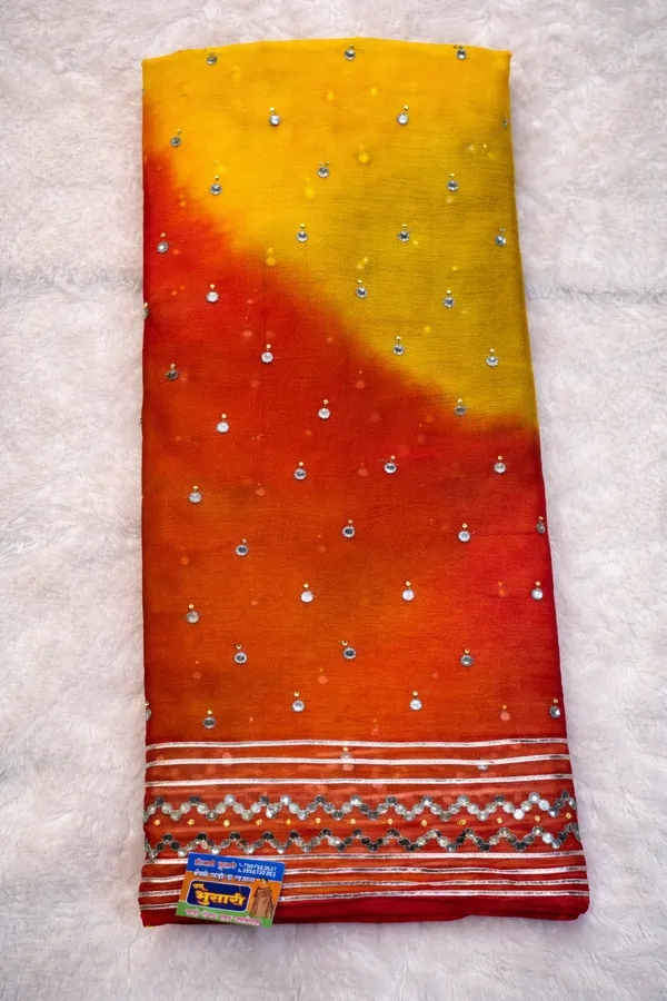 Yellow_To_Red_Ombre_Georgette_Saree_With_Embellished_Border_And_Mirror_Work