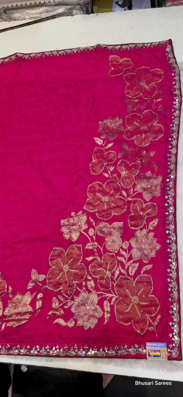 Pink_Georgette_Saree_With_Embroidered_Border_And_Floral_Motifs