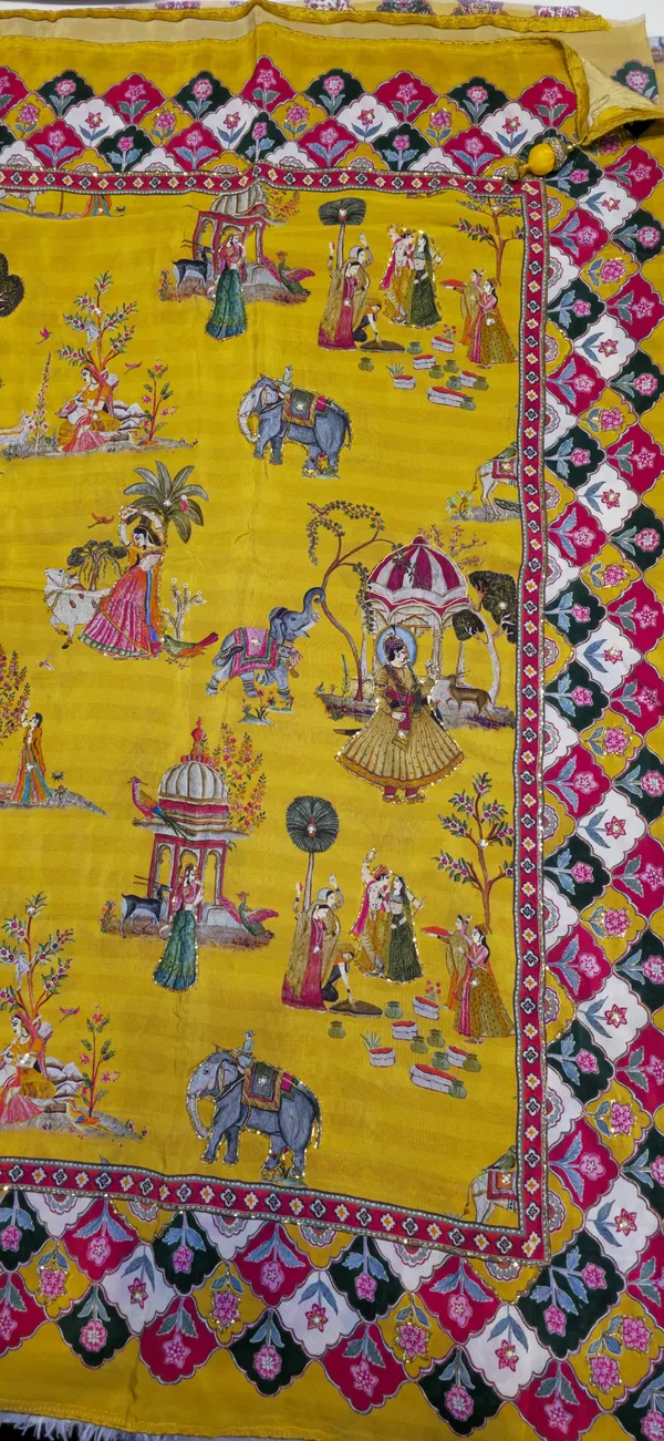 Yellow_Silk_Saree_With_Intricate_Ethnic_Motifs_And_Multicolor_Border