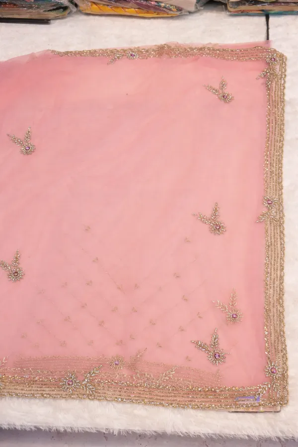 Pink_Embroidered_Net_Saree_With_Golden_Border_And_Embellishments