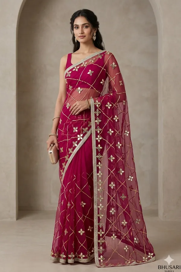Magenta_Embroidered_Net_Saree_With_Sequin_Work_And_Embellished_Border