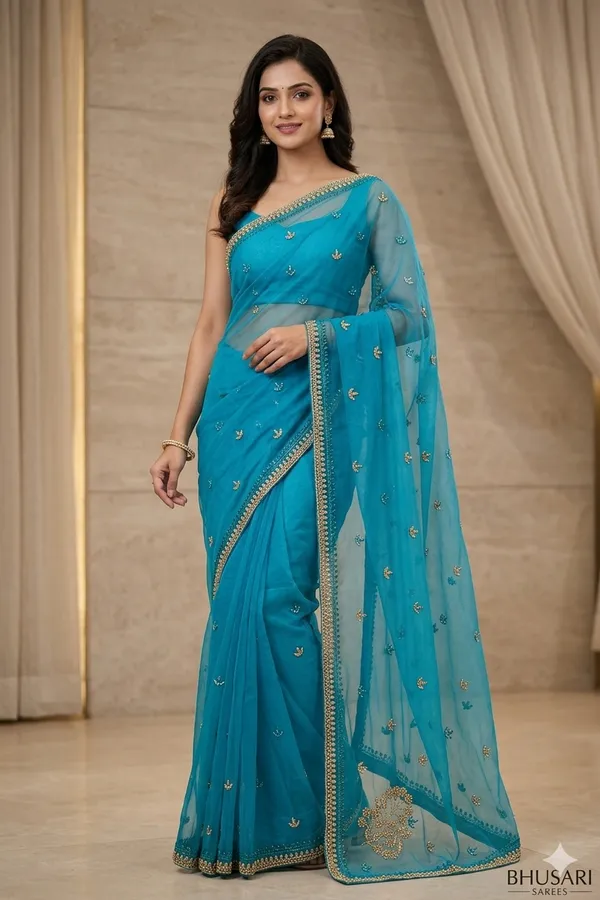 Turquoise_Blue_Embroidered_Georgette_Saree_With_Golden_Border