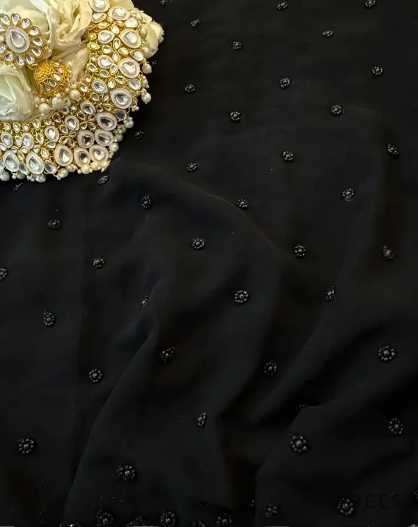 Black_Embellished_Chiffon_Saree_With_Kundan_Brooch