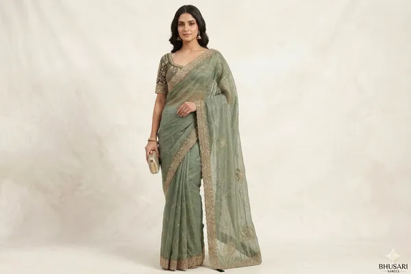 Mint_Green_Embroidered_Organza_Saree_With_Heavy_Embellished_Blouse