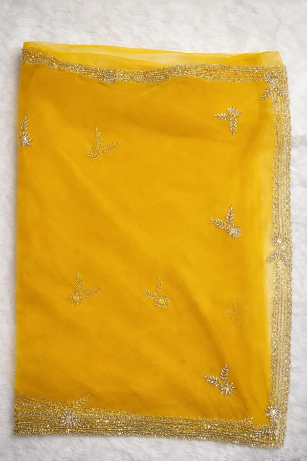 Yellow_Embellished_Organza_Saree_With_Golden_Border_And_Floral_Motifs