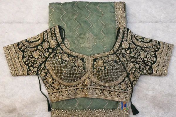 Mint_Green_Embroidered_Organza_Saree_With_Heavy_Embellished_Blouse