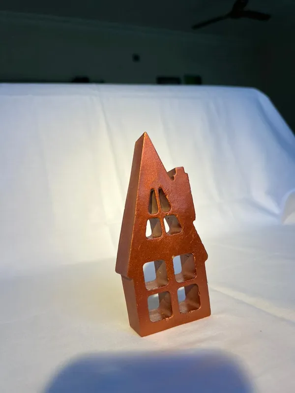 Rustic_Metal_House_Candle_Holder_With_Cutout_Windows