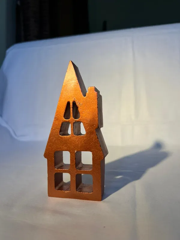 Rustic_Metal_House_Candle_Holder_With_Cutout_Windows