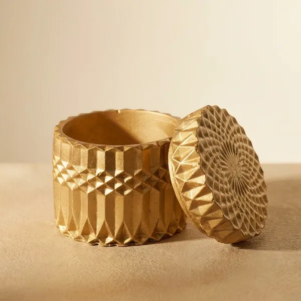 Decorative_Golden_Textured_Cylindrical_Storage_Container_With_Geometric_Pattern_Lid