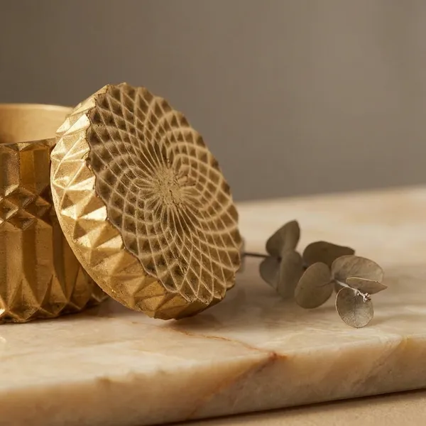 Decorative_Golden_Textured_Cylindrical_Storage_Container_With_Geometric_Pattern_Lid