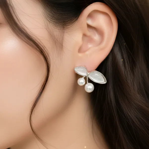 Elegant_Pearl_Leaf_Stud_Earrings_White_Enamel_&_Silver_Tone