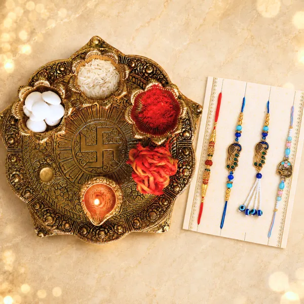 Chhariya_Crafts_Bhaiya_Bhabhi_Bhaiya_Bhabhi_Rakhi_Combo_Gift_Set_1_Metal_Pooja_Thali,_Chawal_Roli_Pack,_1_Designer_Lumba_Rakhi_For_Bhabhi,_1_Designer_Rakhi_For_Bhaiya_Brother,_2_Extra_Rakhi_)_Assorted,_Gold_Finish,_Kundan,_Pearl,_Plastic_(PVC)_Rakhi,_Thali,_Chawal_Roli_Pack__Set_(1_Pooja_Thali,_Chawal_Roli_Pack,_1_Designer_Lumba_Rakhi_For_Bhabhi,_1_Designer_Rakhi_For_Bhaiya_Brother,_2_Extra_Rakhi_))