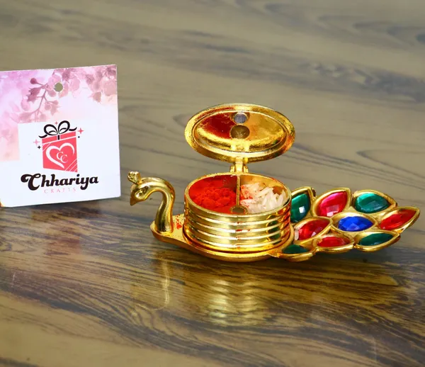 Chhariya_Crafts_Bhaiya_Bhabhi_Bhaiya_Bhabhi_Rakhi_Combo_Gift_Set_Assorted,_Gold_Finish,_Kundan,_Pearl,_Plastic_(PVC),_Zardosi_Rakhi,_Chawal_Roli_Pack__Set_(1_Metal_Peacock_Showpiece_With_KumKum_Box,_Chawal_Roli_Pack,_1_Designer_Lumba_Rakhi_For_Bhabhi,_1_Designer_Rakhi_For_Bhaiya_Brother,_2_Extra_Rakhi_))