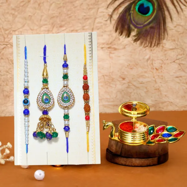 Chhariya_Crafts_Bhaiya_Bhabhi_Bhaiya_Bhabhi_Rakhi_Combo_Gift_Set_Assorted,_Gold_Finish,_Kundan,_Pearl,_Plastic_(PVC),_Zardosi_Rakhi,_Chawal_Roli_Pack__Set_(1_Metal_Peacock_Showpiece_With_KumKum_Box,_Chawal_Roli_Pack,_1_Designer_Lumba_Rakhi_For_Bhabhi,_1_Designer_Rakhi_For_Bhaiya_Brother,_2_Extra_Rakhi_))