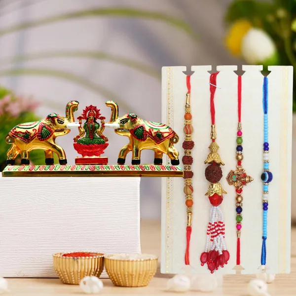 Chhariya_Crafts_Bhaiya_Bhabhi_Bhaiya_Bhabhi_Rakhi_Combo_Gift_Set_Assorted_Rakhi,_Lumba,_Chawal_Roli_Pack,_Showpiece__Set_(1_Metal_Laxmi_Idol_with_kumkum_box_and_elephant_pair,_Chawal_Roli_Pack,_1_Designer_Lumba_Rakhi_For_Bhabhi,_1_Designer_Rakhi_For_Bhaiya_Brother,_2_Extra_Rakhi)