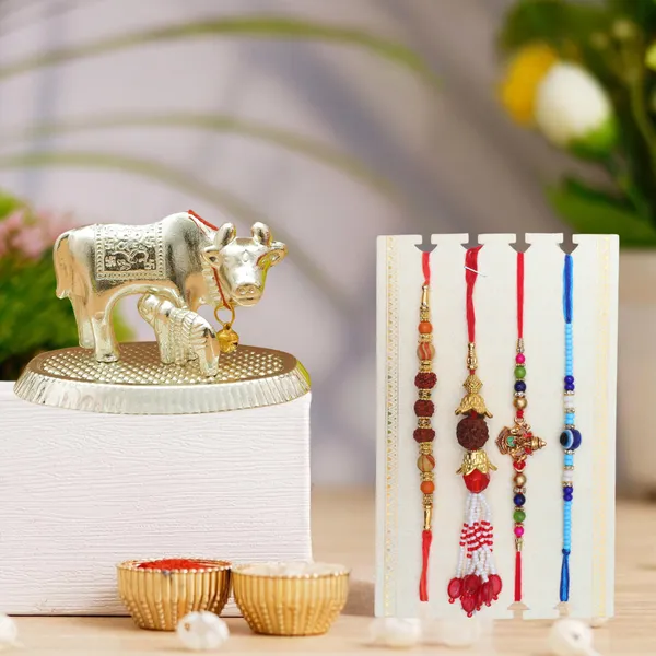 Chhariya_Crafts_Bhaiya_Bhabhi_Rakhi_Combo_Set_1_Cow,_Chawal_Roli_Pack,_1_Designer_Lumba,_3_Rakhi_Assorted,_Gold,_Gold_Finish,_Jute,_Kundan,_Mauli_Thread,_Pearl,_Yarn_Rakhi,_Chawal_Roli_Pack,_Showpiece__Set_(1_Cow,_1_Chawal_Roli_Pack,_1_Designer_Lumba,_3_Rakhi)