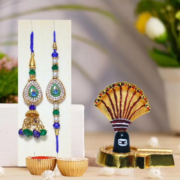 Chhariya_Crafts_Bhaiya_Bhabhi_Bhaiya_Bhabhi_Rakhi_Combo_Gift_Set_Assorted,_Gold,_Gold_Finish,_Jute,_Kundan,_Mauli_Thread,_Pearl,_Yarn_Rakhi,_Chawal_Roli_Pack,_Showpiece__Set_(1_Shiv_Ji_Idol,_1_Chawal_Roli_Pack,_1_Designer_Lumba,_1_Designer_Rakhi)