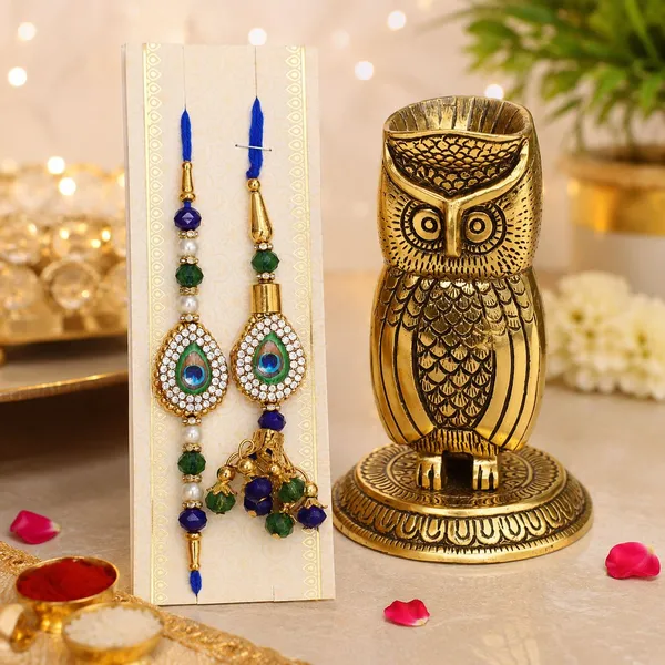 Chhariya_Crafts_Bhaiya_Bhabhi_Bhaiya_Bhabhi_Rakhi_Combo_Gift_Set_Assorted,_Gold,_Gold_Finish,_Jute,_Kundan,_Mauli_Thread,_Pearl,_Yarn_Rakhi,_Chawal_Roli_Pack,_Showpiece__Set_(1_Owl_Penstand_Vastu,_1_Chawal_Roli_Pack,_1_Designer_Lumba,_1_Designer_Rakhi)