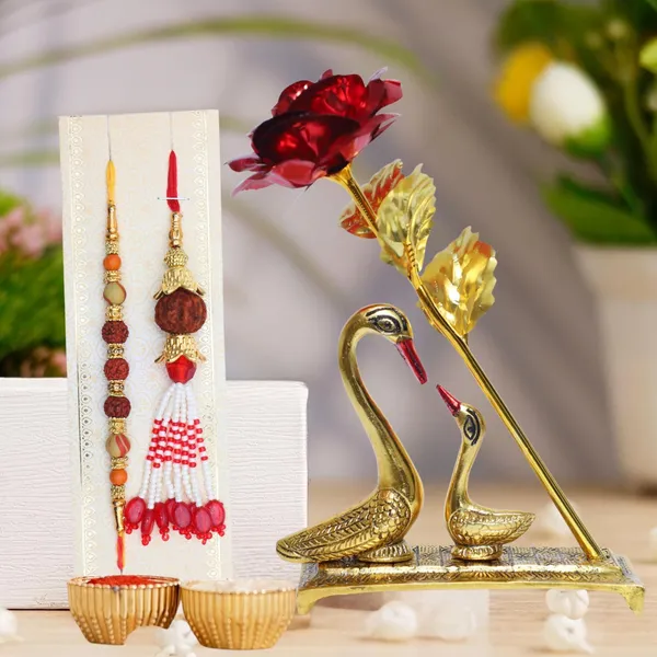 Chhariya_Crafts_Bhaiya_Bhabhi_Bhaiya_Bhabhi_Rakhi_Combo_Gift_Set_Assorted,_Gold,_Gold_Finish,_Jute,_Kundan,_Mauli_Thread,_Pearl,_Yarn_Rakhi,_Chawal_Roli_Pack,_Showpiece__Set_(1_Duck_Pair_Showpieces,_1_Chawal_Roli_Pack,_1_Designer_Lumba,_1_Designer_Rakhi)