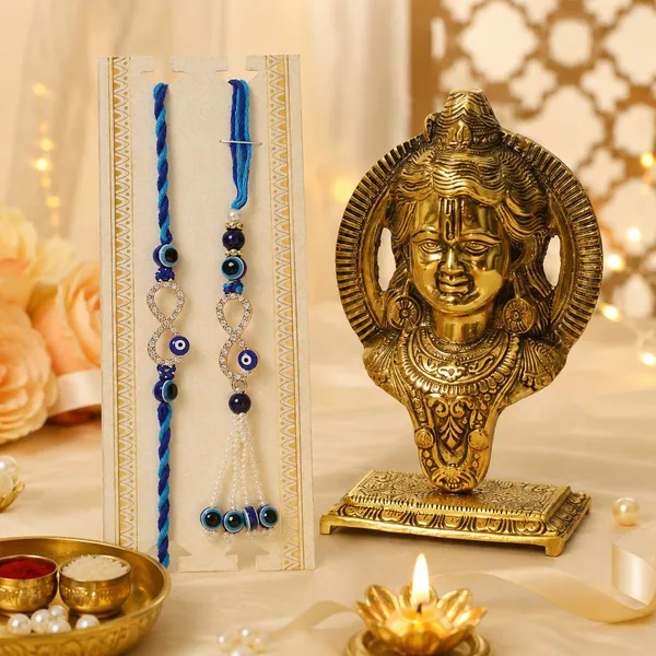 Chhariya_Crafts_Bhaiya_Bhabhi_Bhaiya_Bhabhi_Rakhi_Combo_Gift_Set_Assorted,_Gold_Finish,_Kundan,_Mauli_Thread,_Pearl,_Zardosi_Rakhi,_Chawal_Roli_Pack,_Showpiece,_Lumba__Set_(1_Metal_Ram_Lalla,_Chawal_Roli_Pack,_1_Designer_Lumba,_1_Designer_Rakhi)