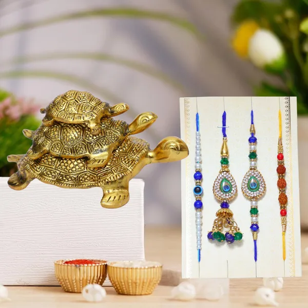Chhariya_Crafts_Bhaiya_Bhabhi_Bhaiya_Bhabhi_Rakhi_Combo_Gift_Set_Assorted,_Gold_Finish,_Jute,_Pearl,_Plastic_(PVC),_Zardosi_Rakhi,_Showpiece,_Lumba,_Chawal_Roli_Pack__Set_(3_Metal_Tortoise_Showpieces,_1_Chawal_Roli_Pack,_1_Designer_Lumba,_3_Designer_Rakhi)
