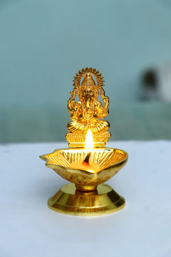 Chhariya_Crafts_Bhaiya_Bhabhi_Bhaiya_Bhabhi_Rakhi_Combo_Gift_Set_Assorted,_Gold_Finish,_Jute,_Pearl,_Plastic_(PVC),_Zardosi_Rakhi,_Showpiece,_Lumba,_Chawal_Roli_Pack__Set_(2_Metal_Diya_Showpieces,_1_Chawal_Roli_Pack,_1_Designer_Lumba,_3_Designer_Rakhi)