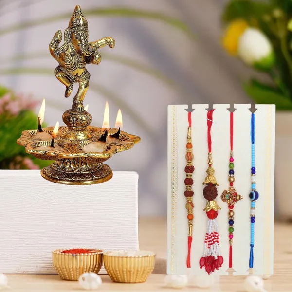 Chhariya_Crafts_Designer_Bhaiya_Bhabhi_Rakhi_Combo_Gift_Set_Assorted,_Gold_Finish,_Jute,_Pearl,_Plastic_(PVC),_Zardosi_Rakhi,_Showpiece,_Lumba,_Chawal_Roli_Pack__Set_(1_Metal_Ganesh_Idol,_1_Chawal_Roli_Pack,_1_Designer_Lumba,_3_Designer_Rakhi)